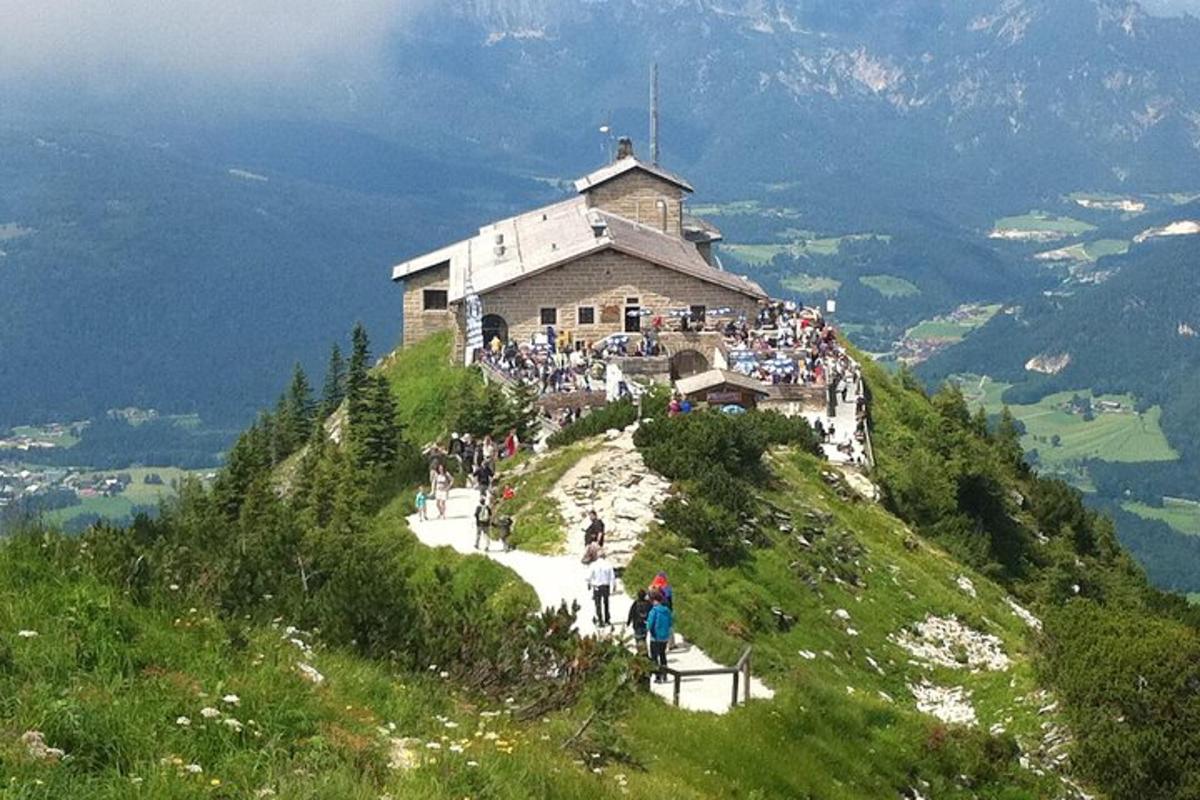 a group of people standing on top of a mountain
