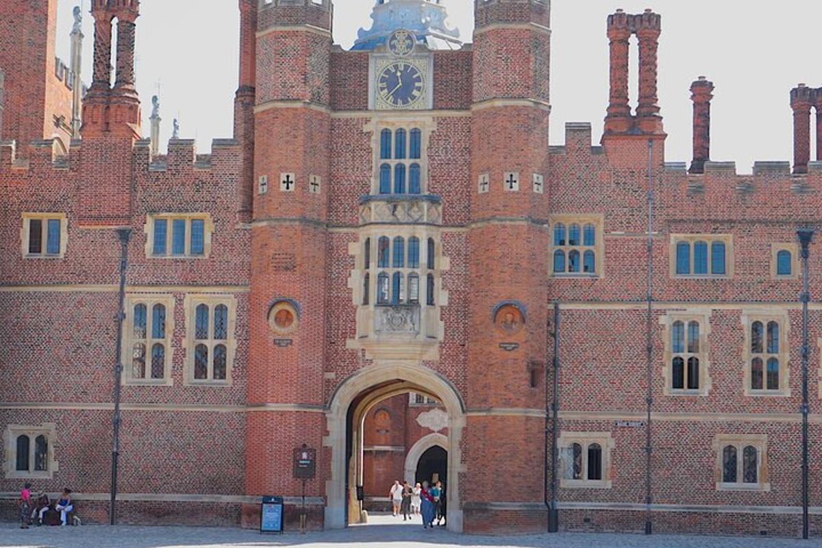 a large red brick building with a clock tower