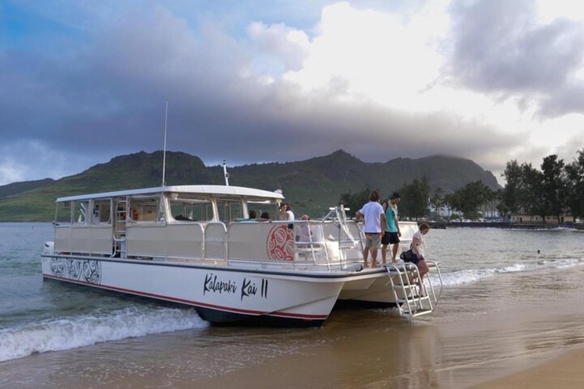 a group of people on a boat on the beach