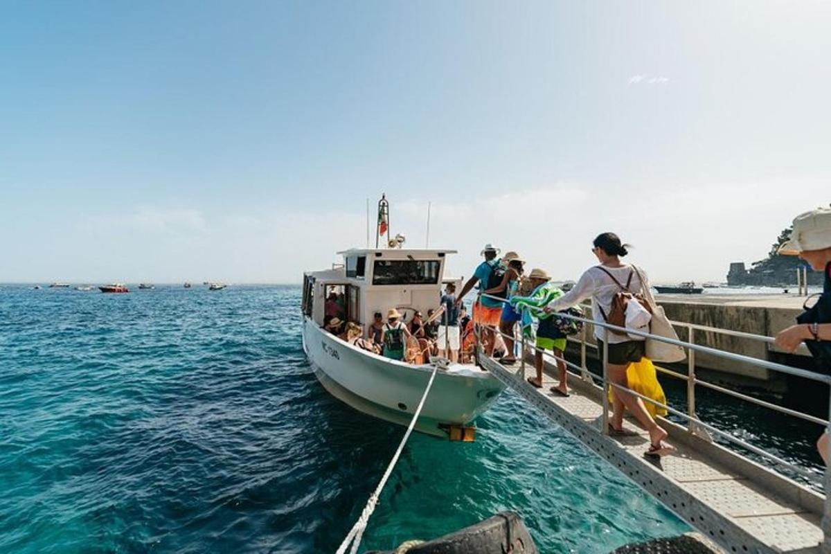 a group of people on a boat in the water
