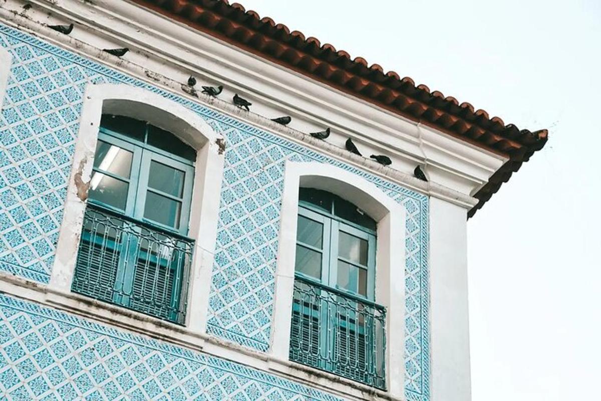 two windows on a blue and white building