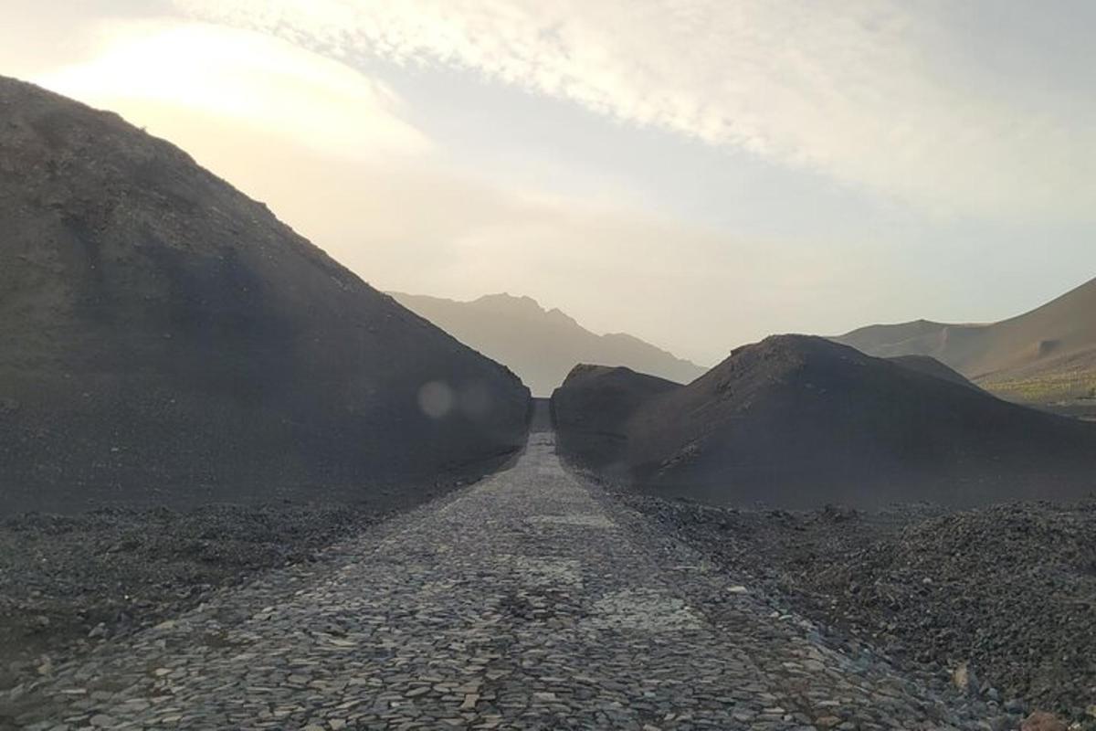 a dirt road in the middle of a mountain