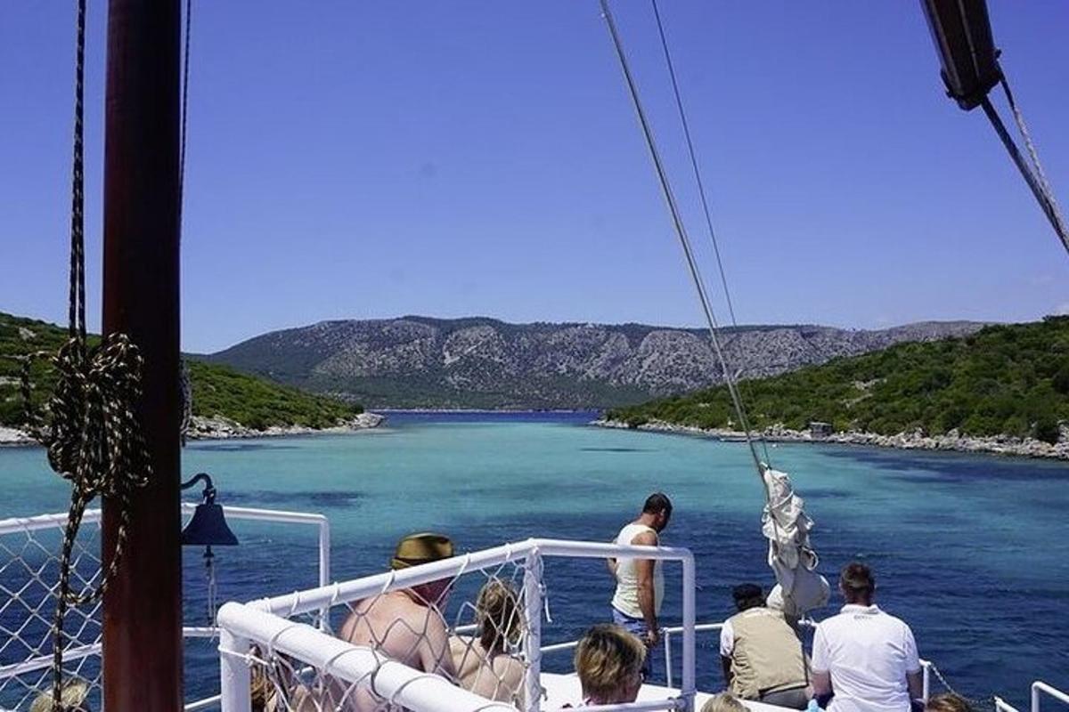 a group of people on a boat in the water