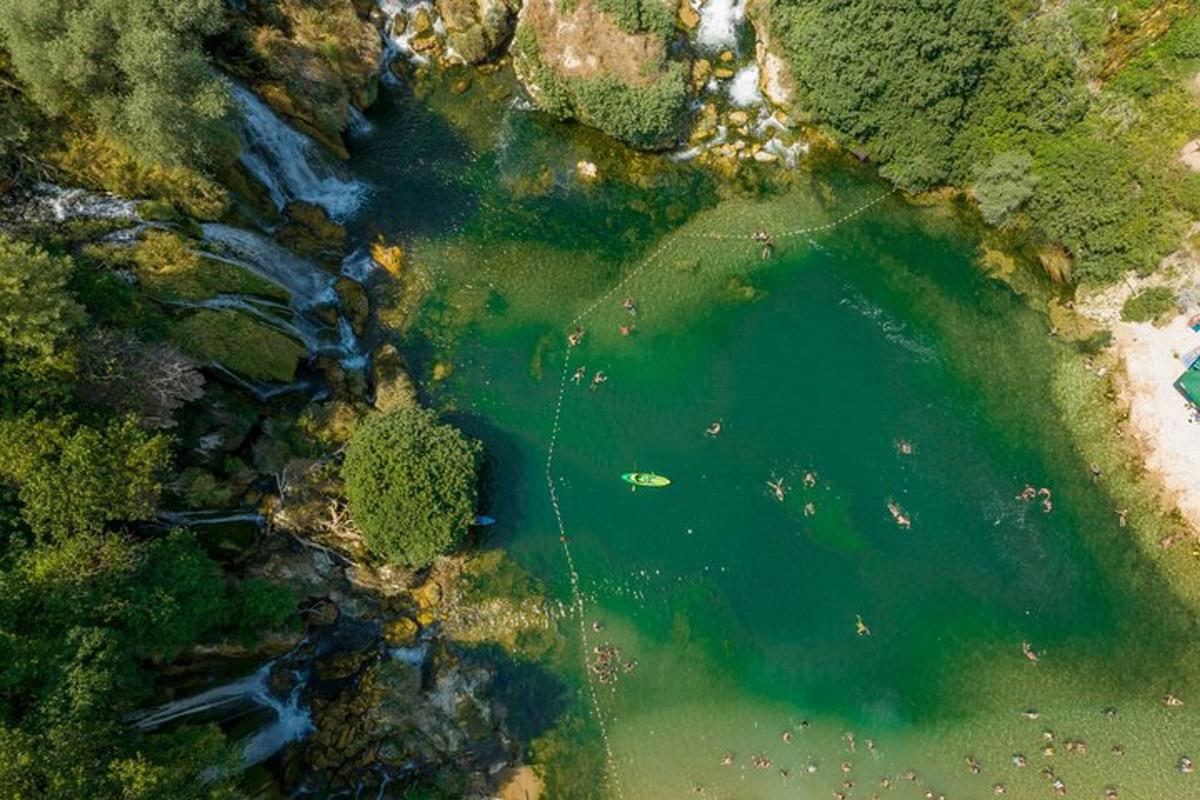 an aerial view of a body of water with trees