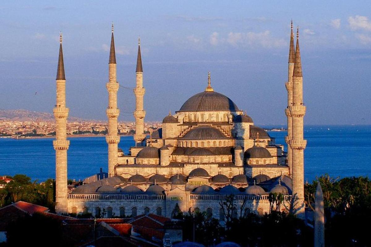 a large building with two domes and a mosque