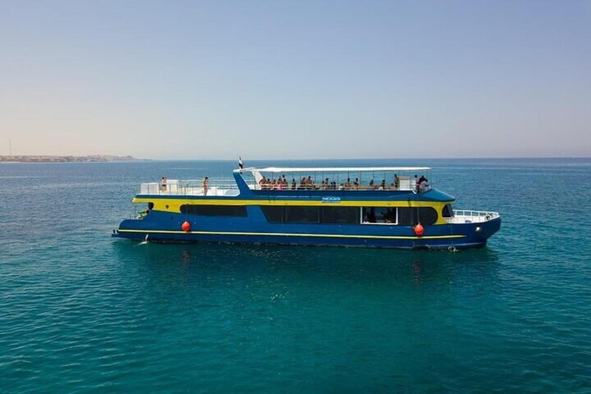 a blue and yellow boat in the water