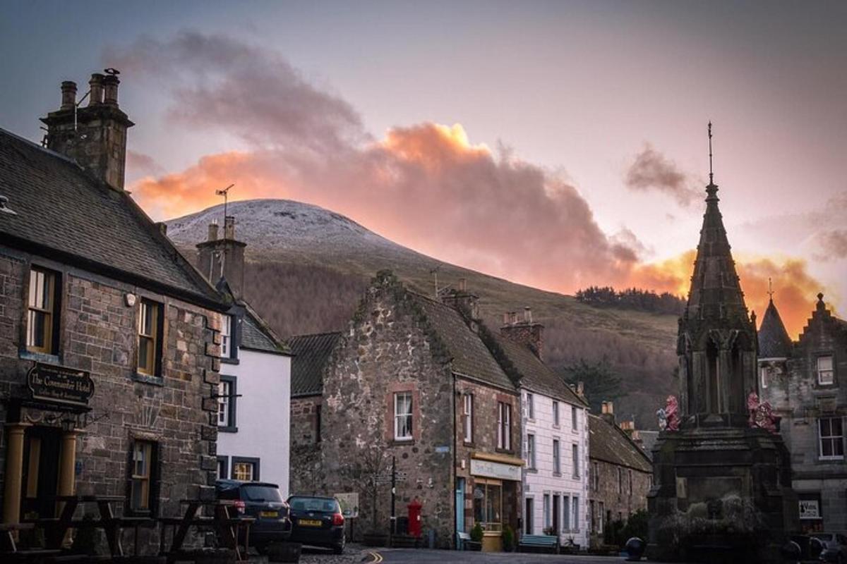 a view of a town with a mountain in the background