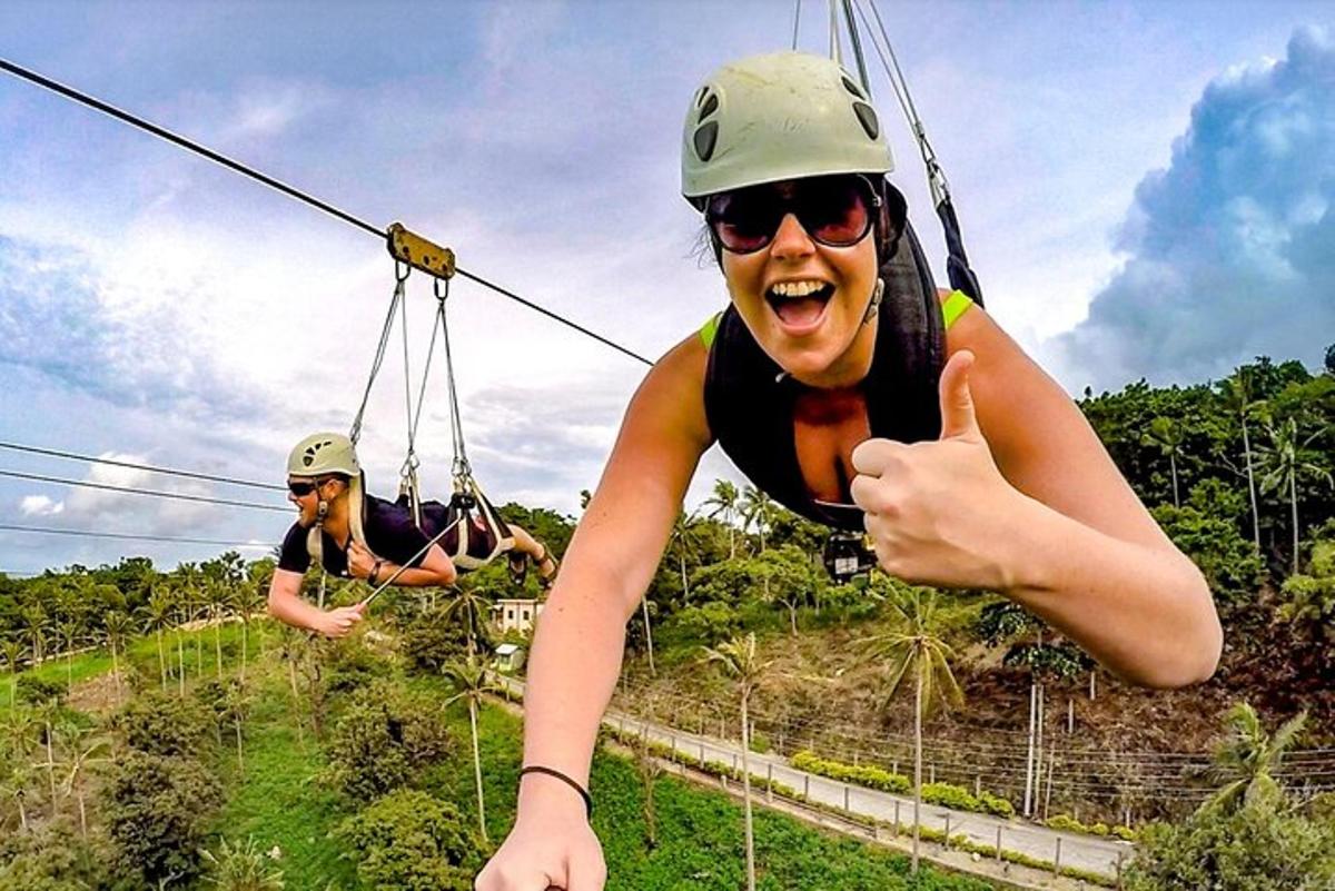 two people riding on the zip line