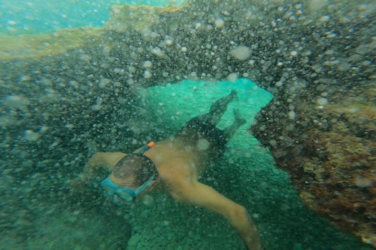a man is swimming in the water