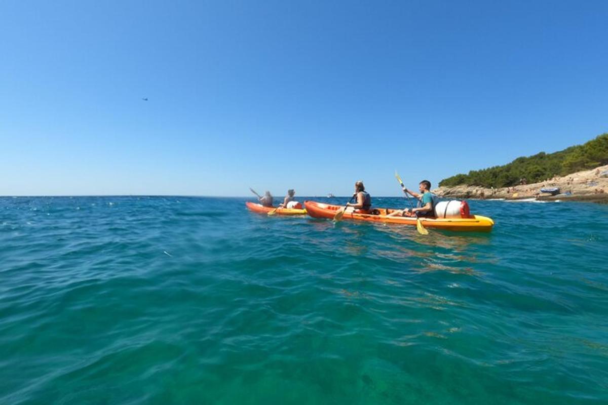a group of people in kayaks in the water