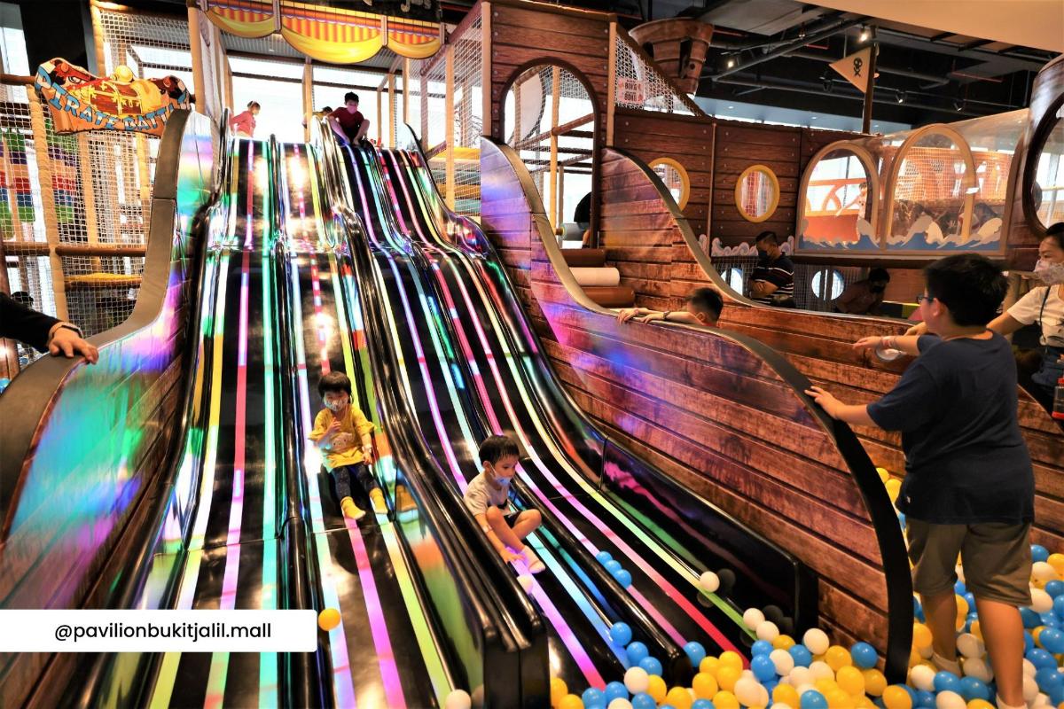 a group of children playing on a bowling alley