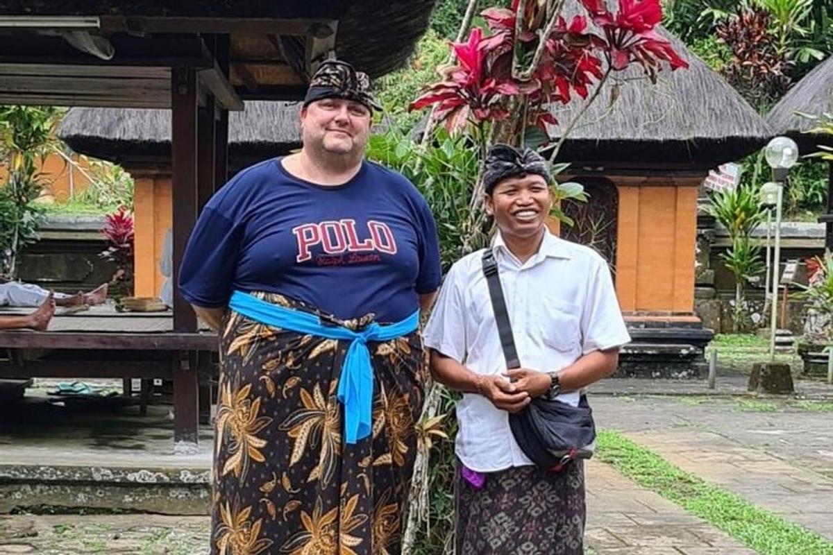 a man and a woman standing in front of a building