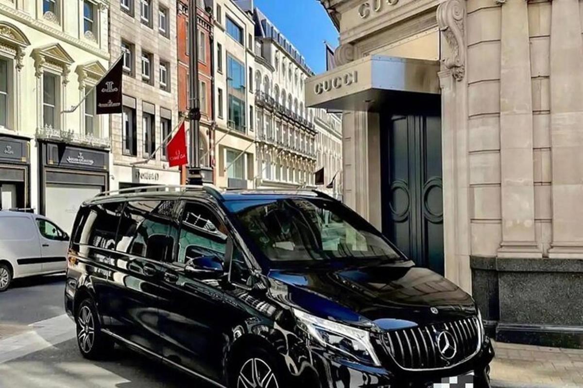 a black car parked in front of a building