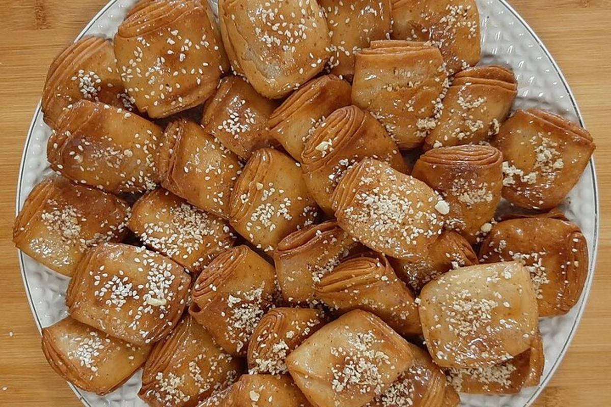 a pile of buns on a plate on a table