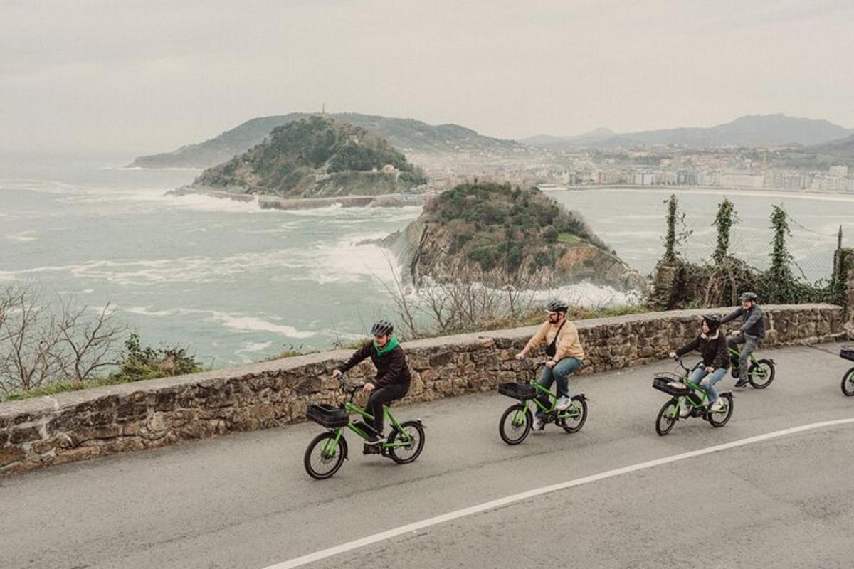 a group of people riding bikes down a road