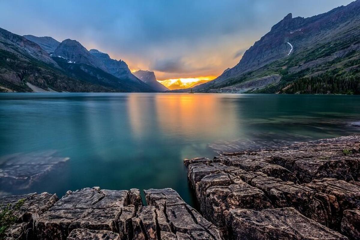 a view of a lake with mountains in the background