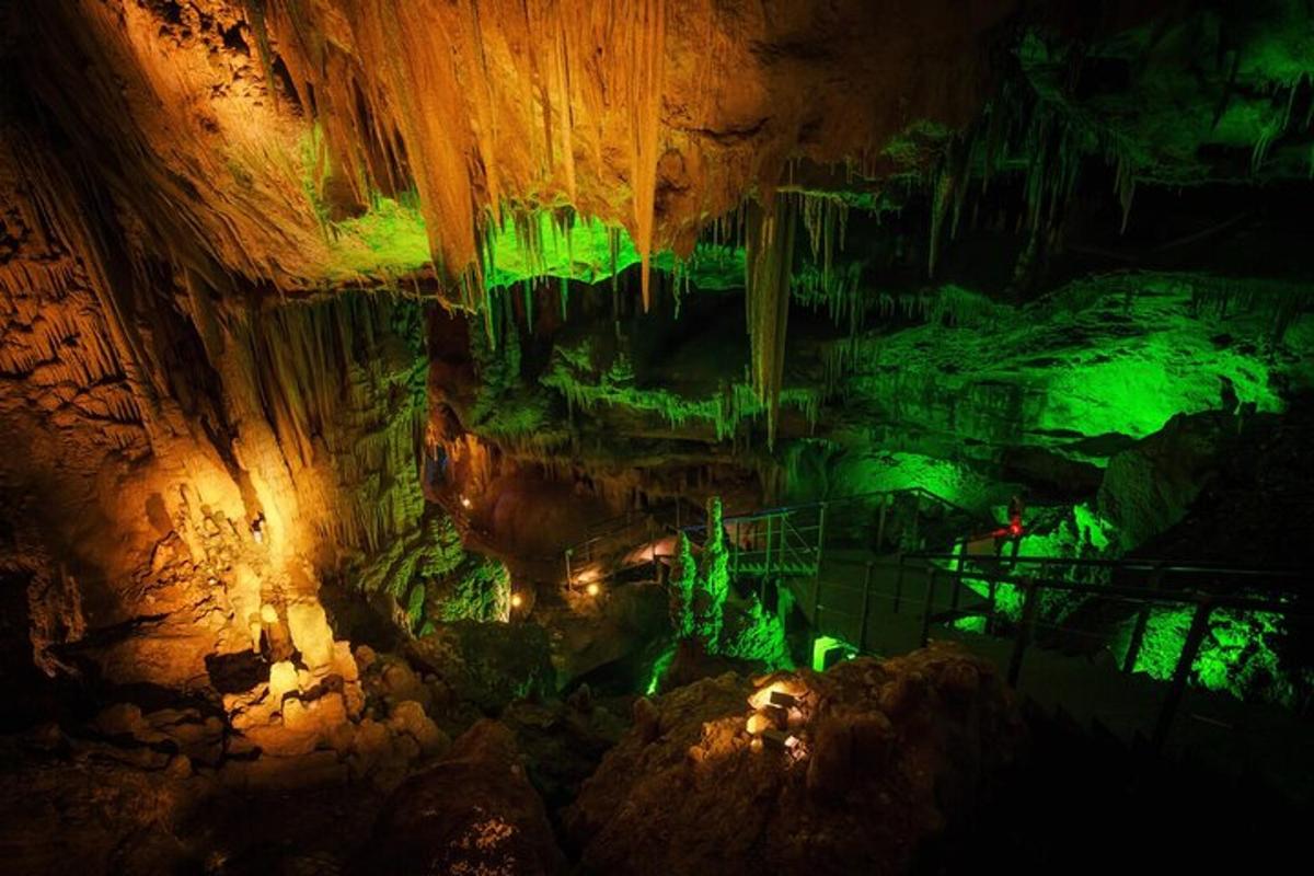 a cave with green lights in the ceiling