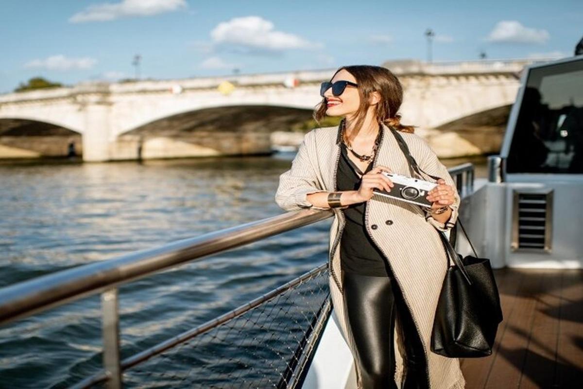 a woman standing on a boat holding a camera