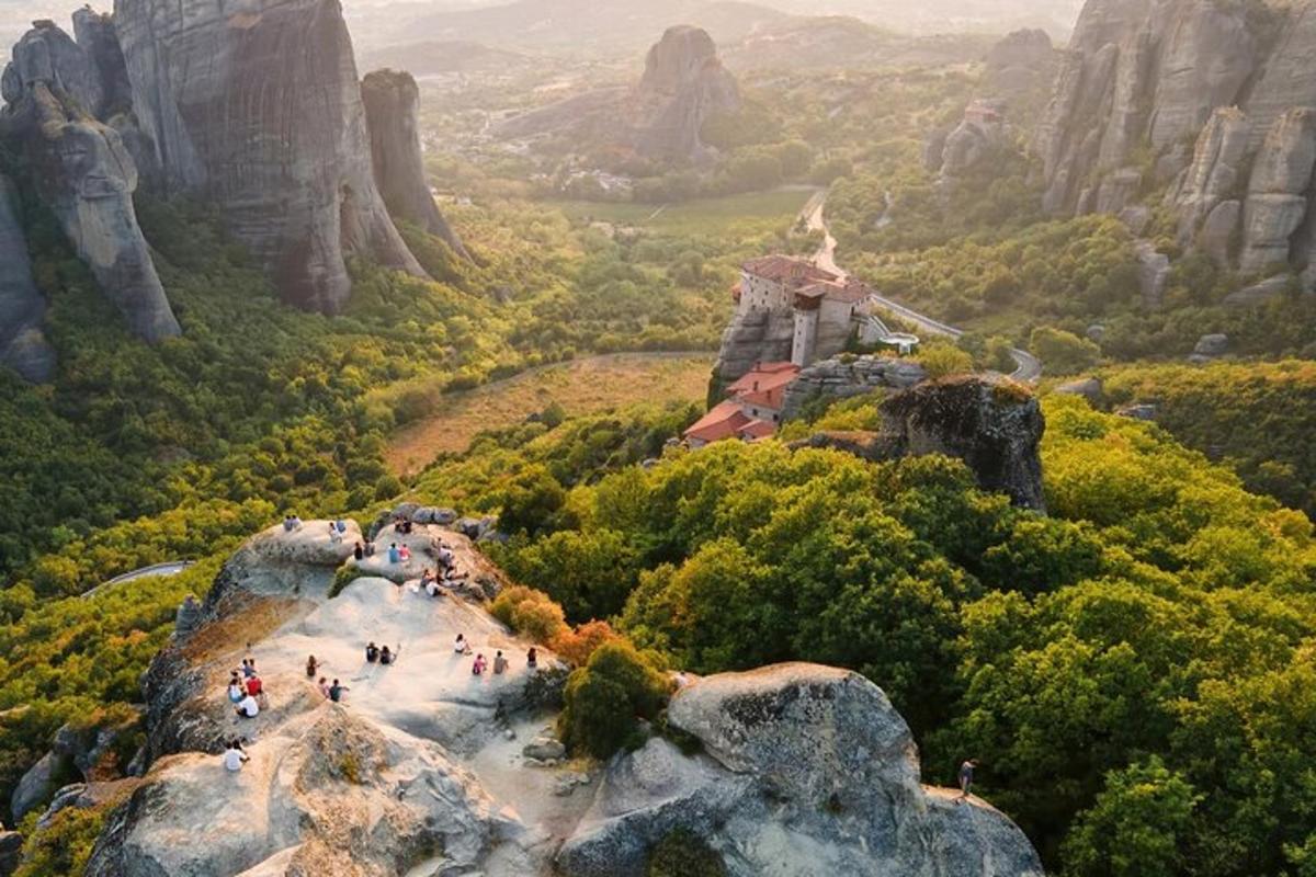 a group of people standing on top of a mountain