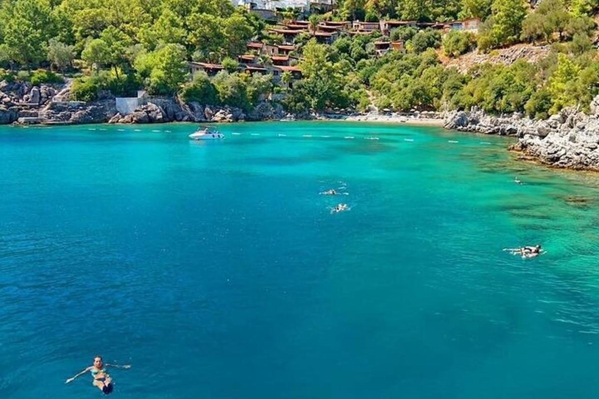 a group of people swimming in a large body of water