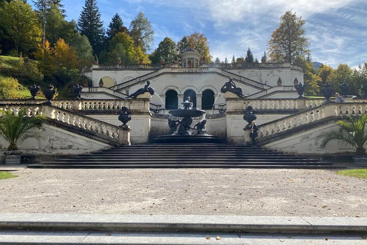 a building with a fountain in front of a staircase