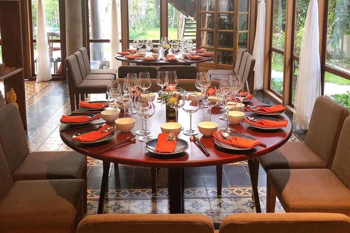 a table with wine glasses and plates on it