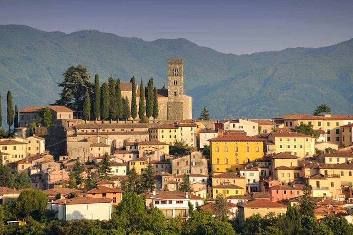a town with a clock tower on a mountain