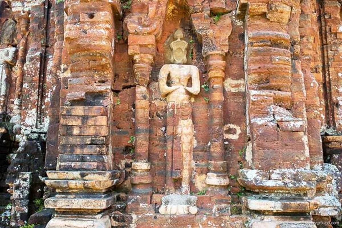 a stone building with a face on the side of it