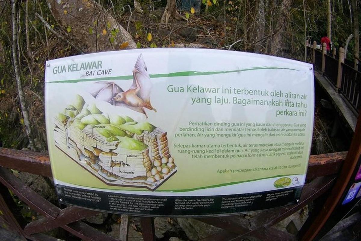 Un cartel colocado encima de un banco de madera.
