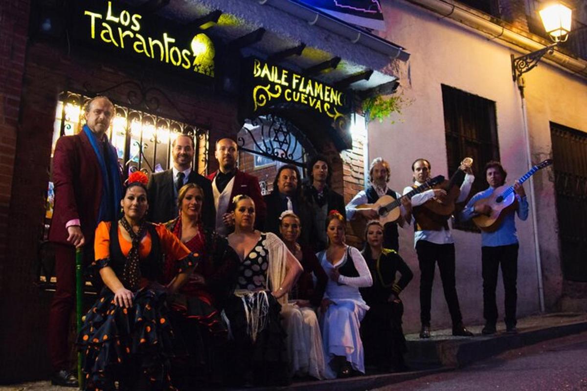 a group of people posing for a picture on the street
