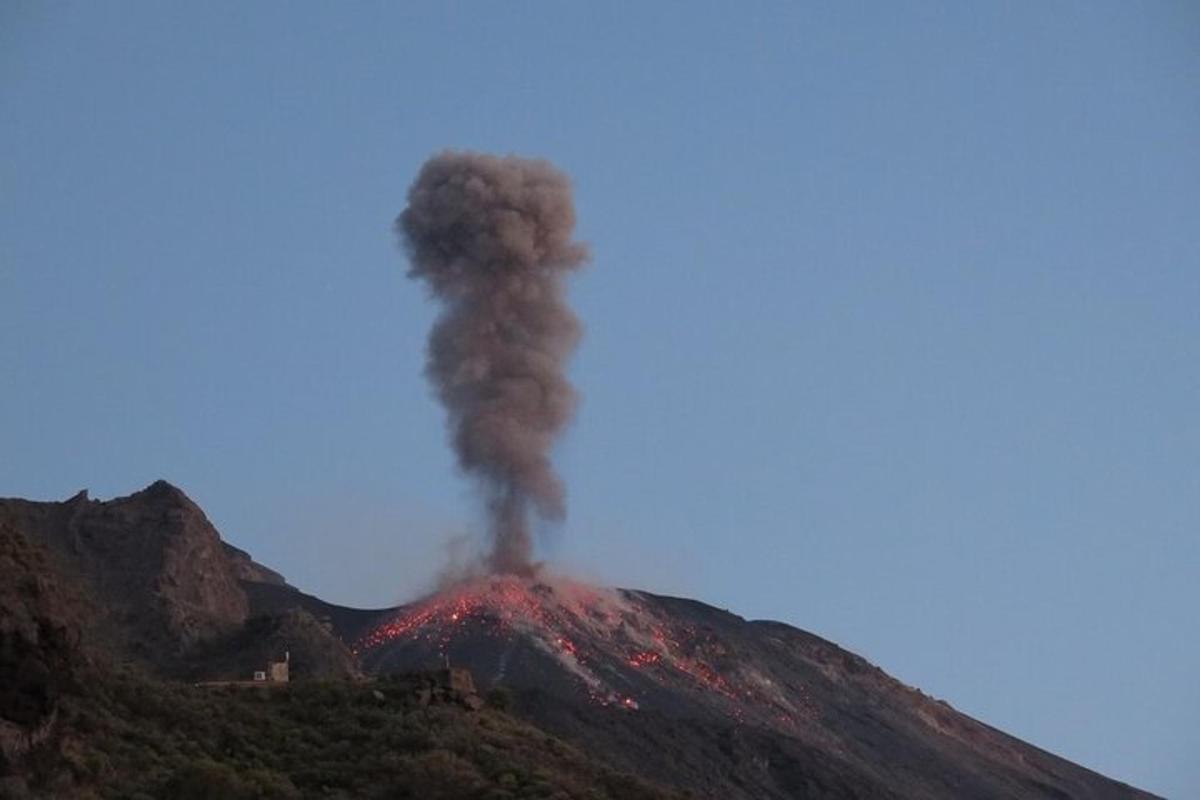 a volcano with smoke coming out of it