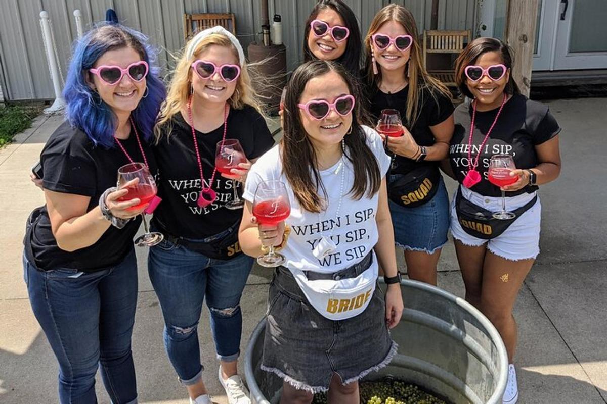 a group of women holding glasses of wine