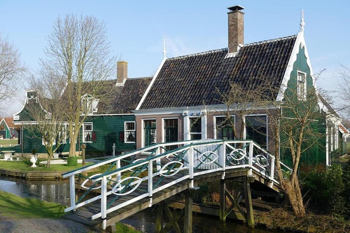 a large house with a bridge in front of it