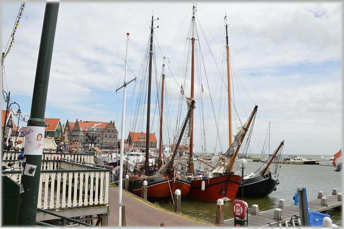 two boats are docked at a dock in the water