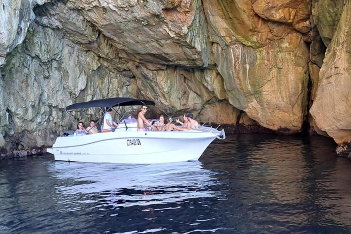 a group of people on a boat in the water