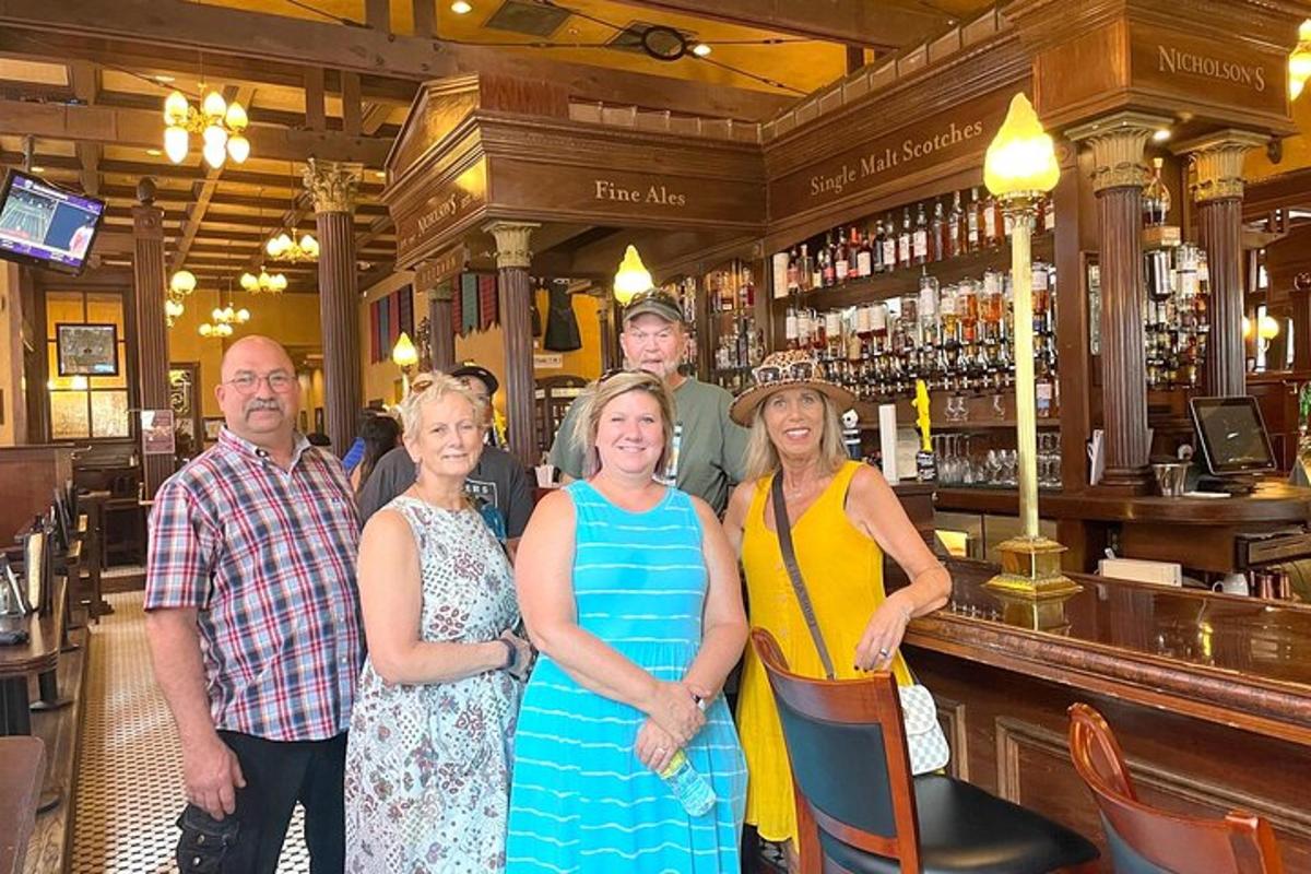 a group of people standing in front of a bar