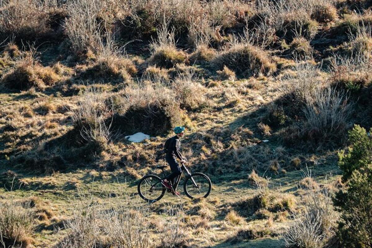 a person riding a bike in a field