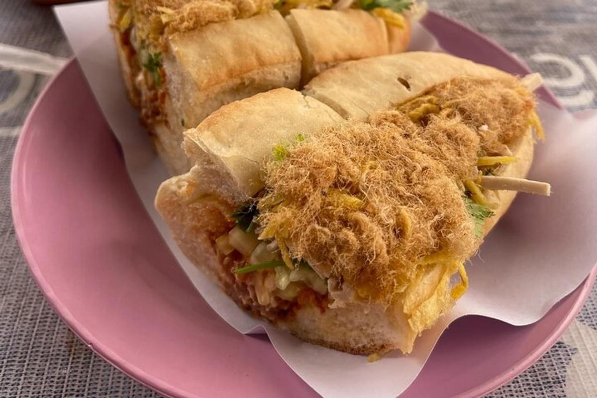 a sandwich on a pink plate on a table