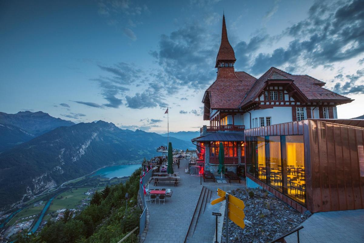a building on top of a mountain with a view