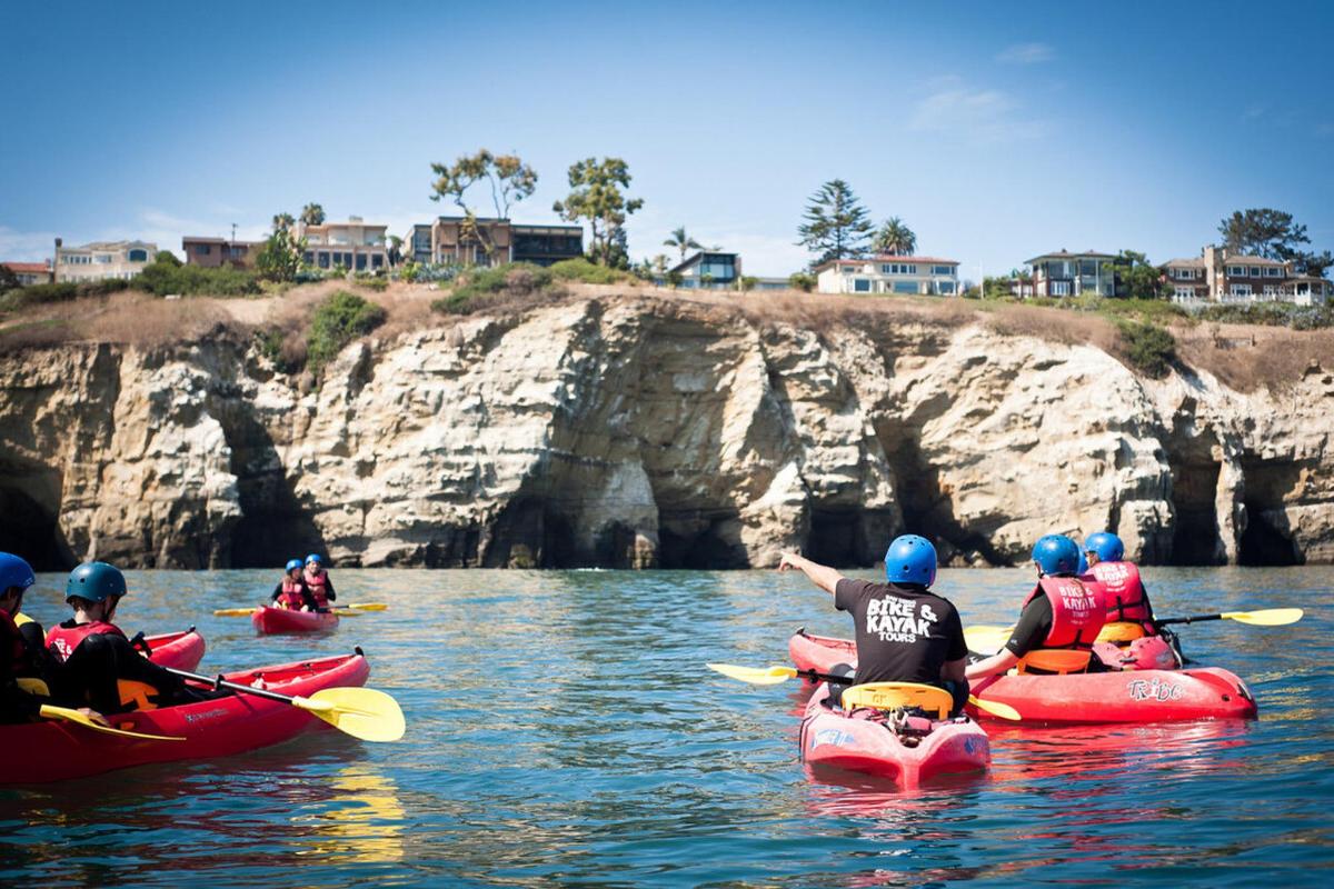 a group of people in kayaks on the water
