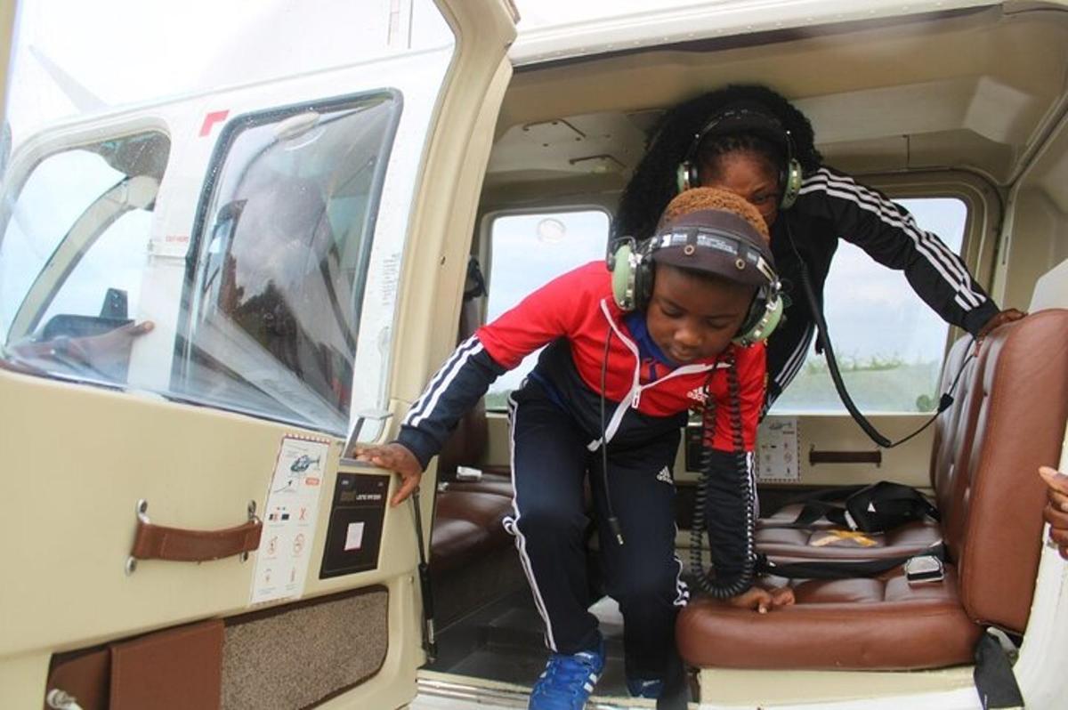 a woman and a child sitting in the back of a van