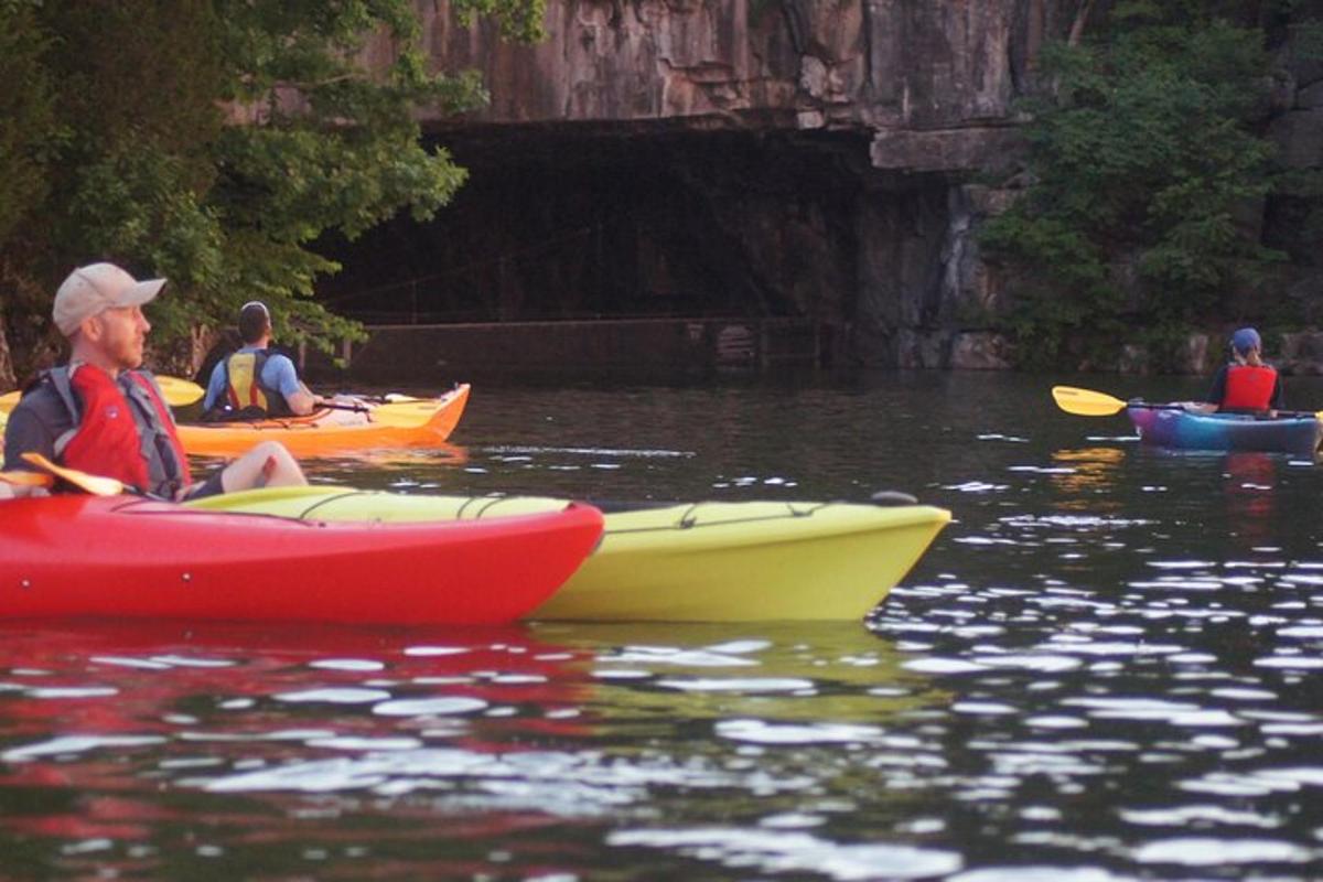 a group of people in kayaks on the water