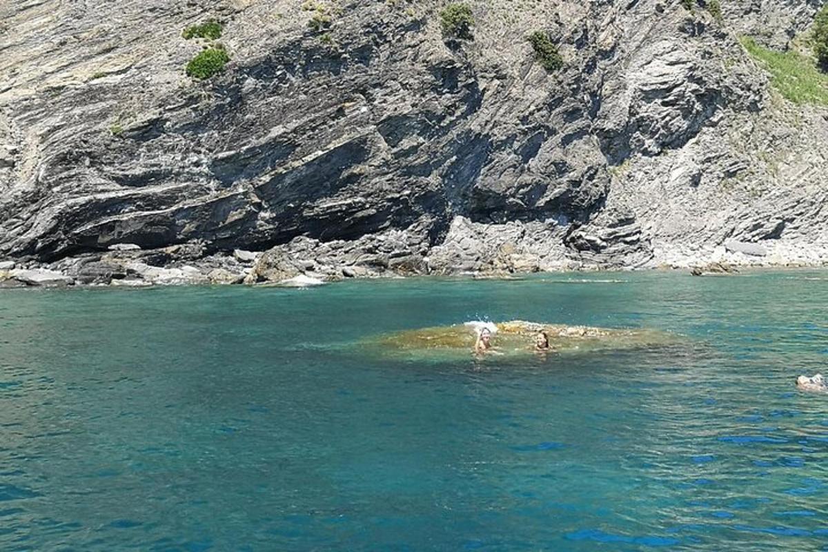 two people swimming in a body of water