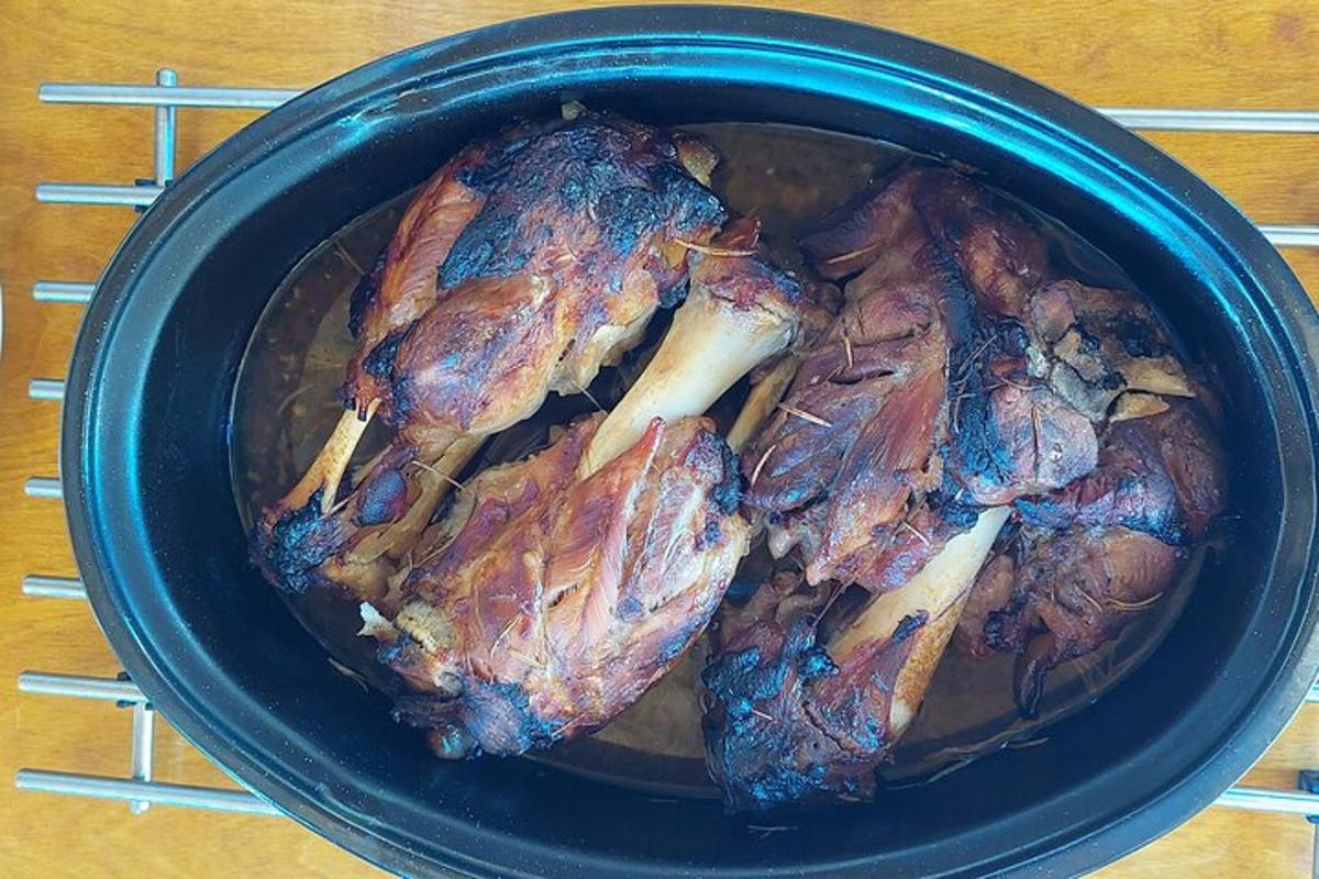 a pot of food with meat in it on a table