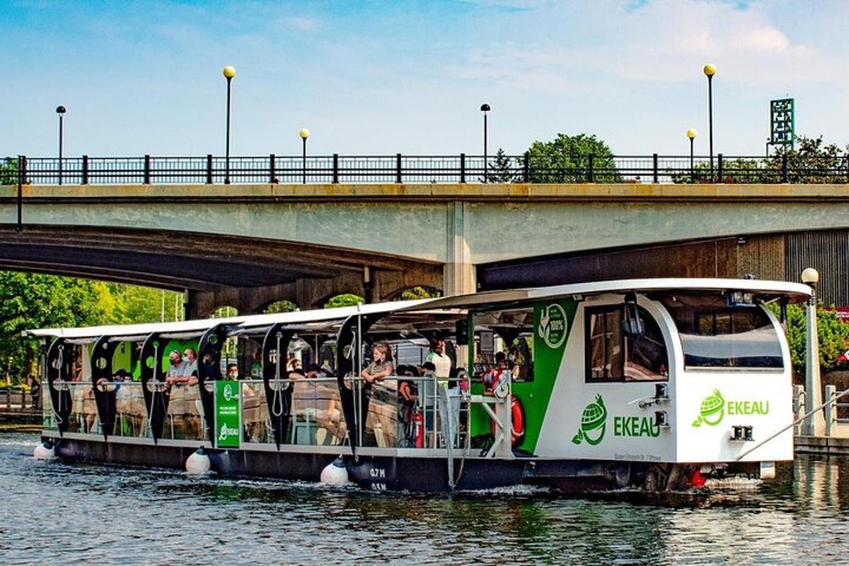 a bus on the water under a bridge