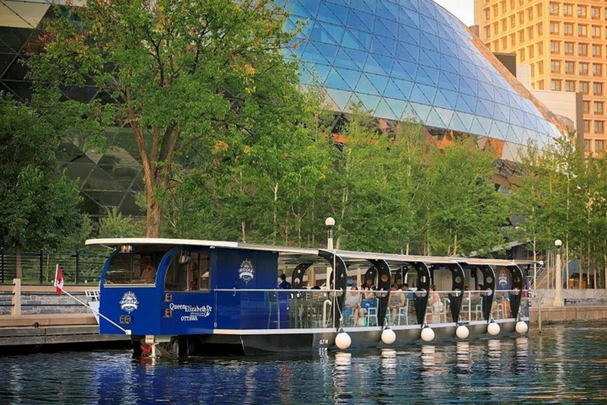 a blue boat in the water in front of a building