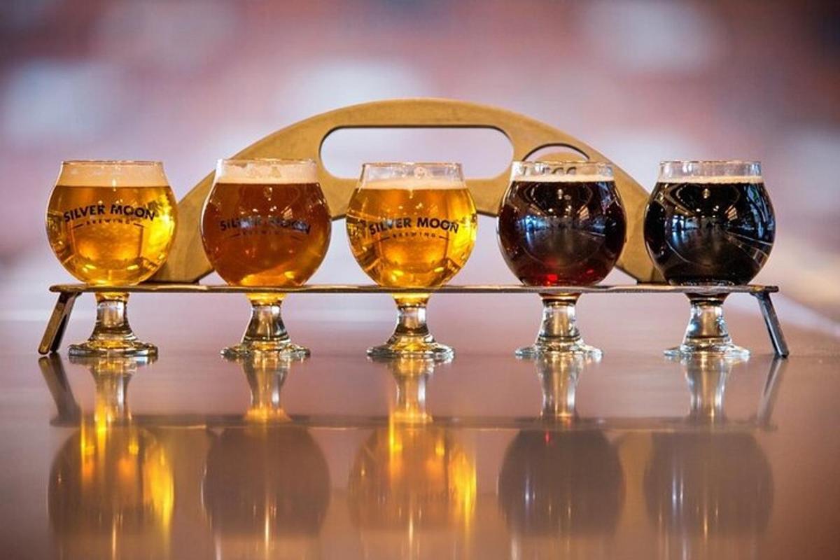 a tray with four beer glasses on a table