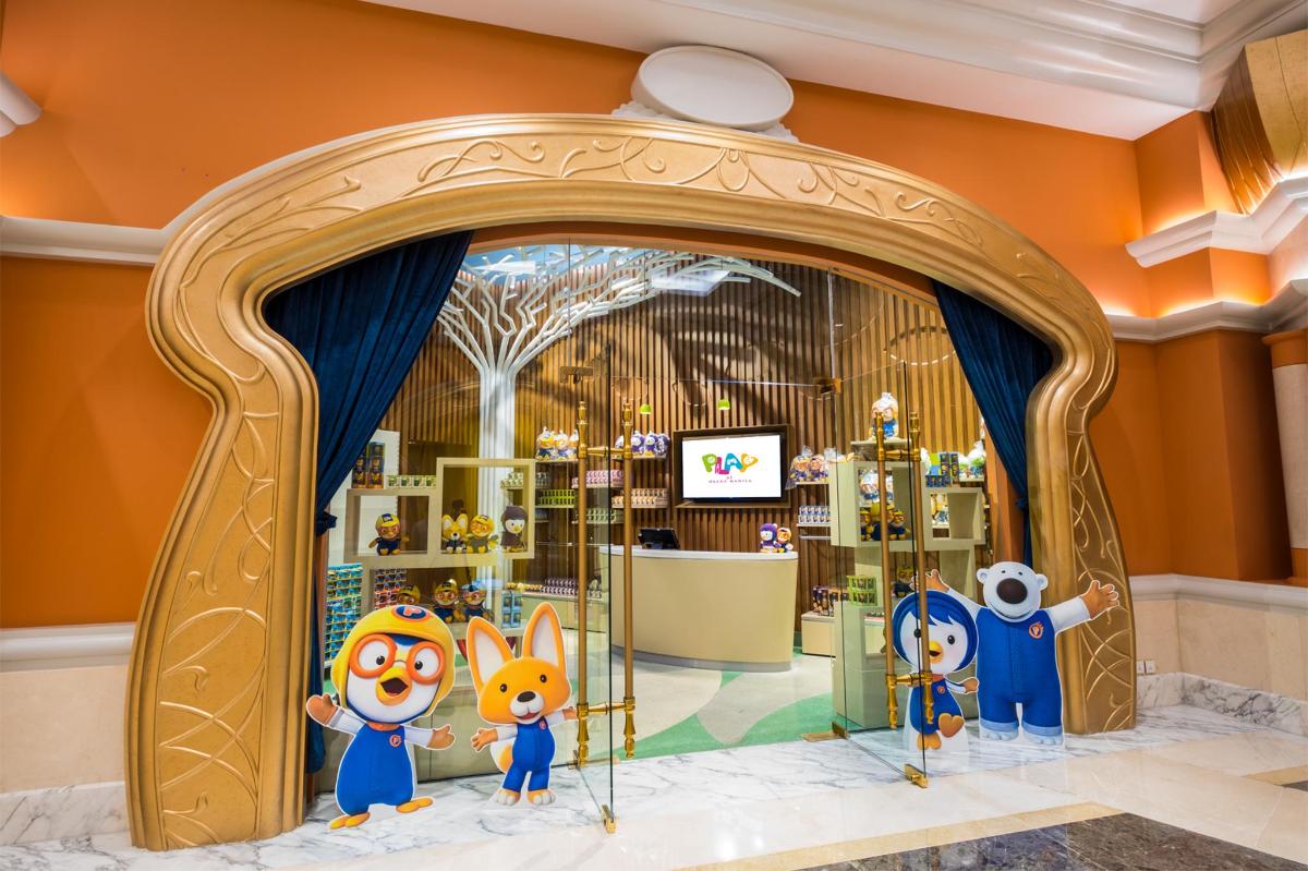 a store with a bunch of stuffed animals in a room