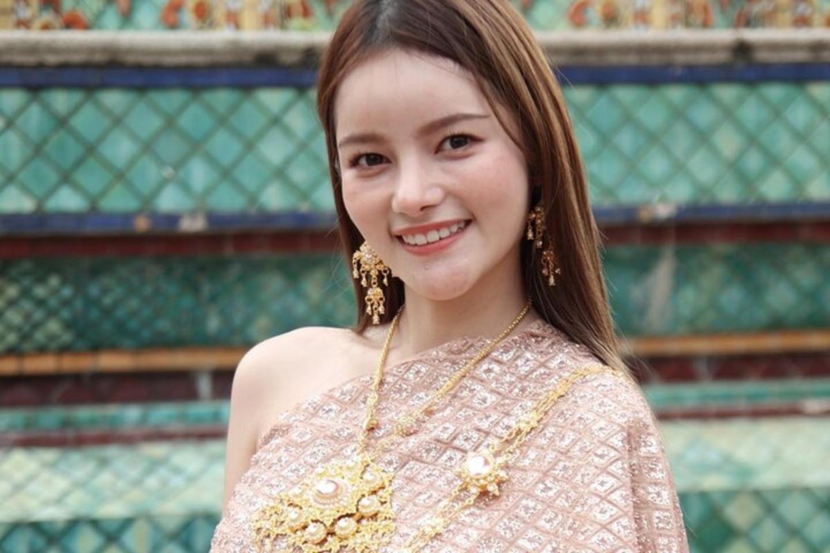 a young woman is smiling for the camera
