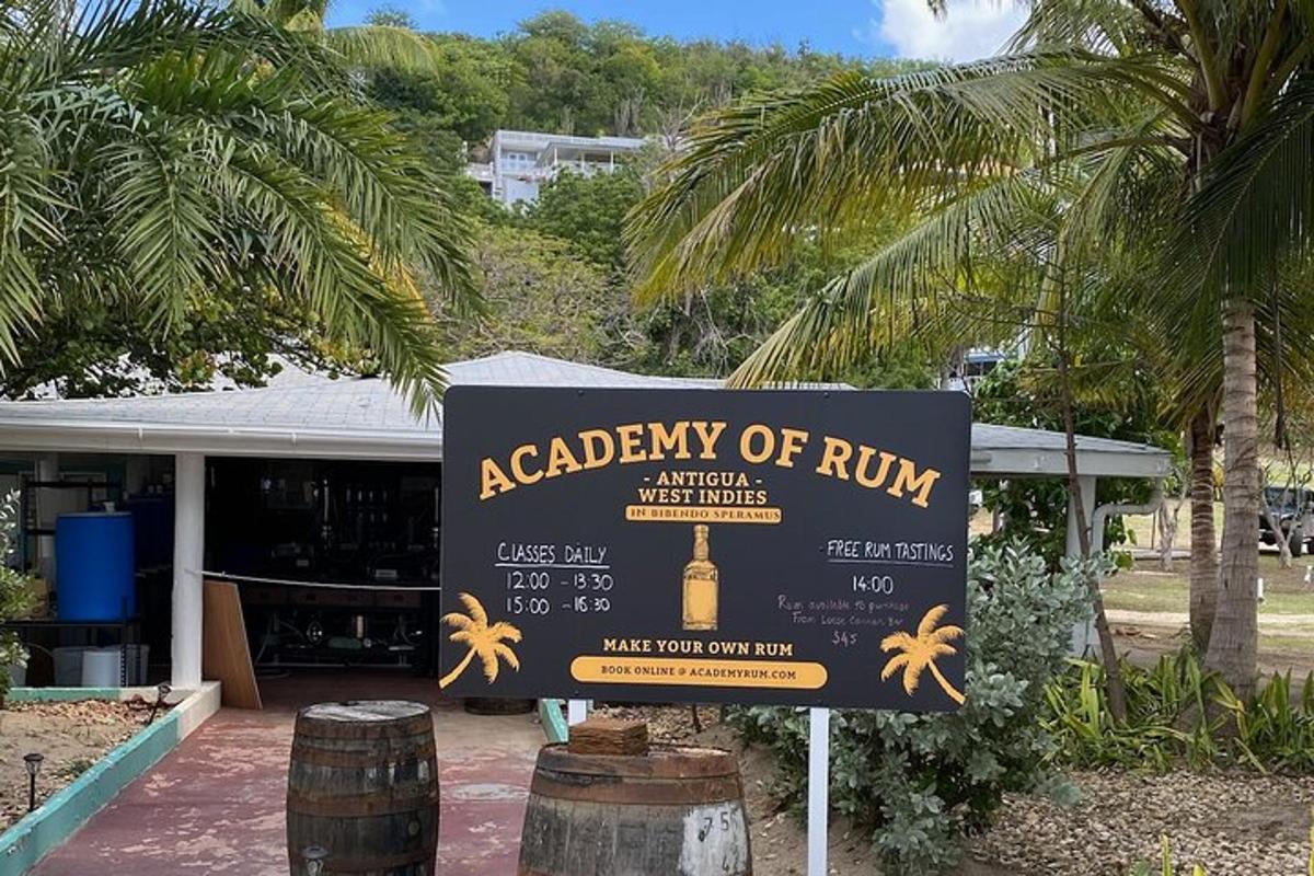 a sign for a academy of rum in front of a building